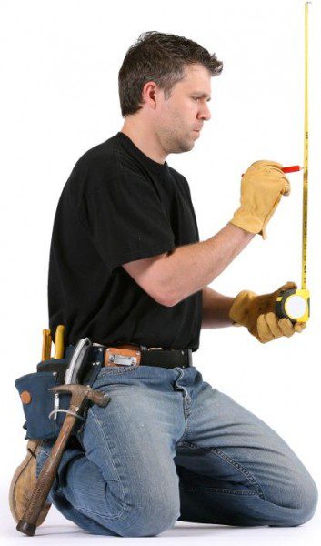 construction worker measuring