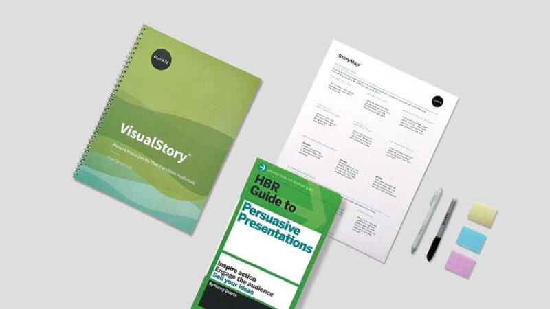 A notebook, brochure, workshop overview, pens, and sticky notes for the VisualStory Workshop.