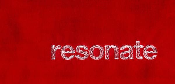 Mockup of a cover for "Resonate" the words resonate are stitched