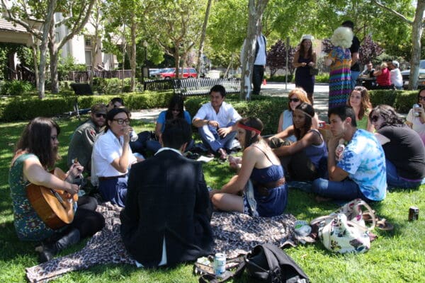 Duarte team outside playing music together on the lawn