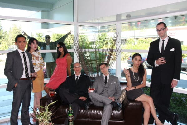 Duarte team poses for a picture in their 60's outfits as Mad Men