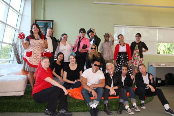 Duarte team poses for a picture in their 50's outfits