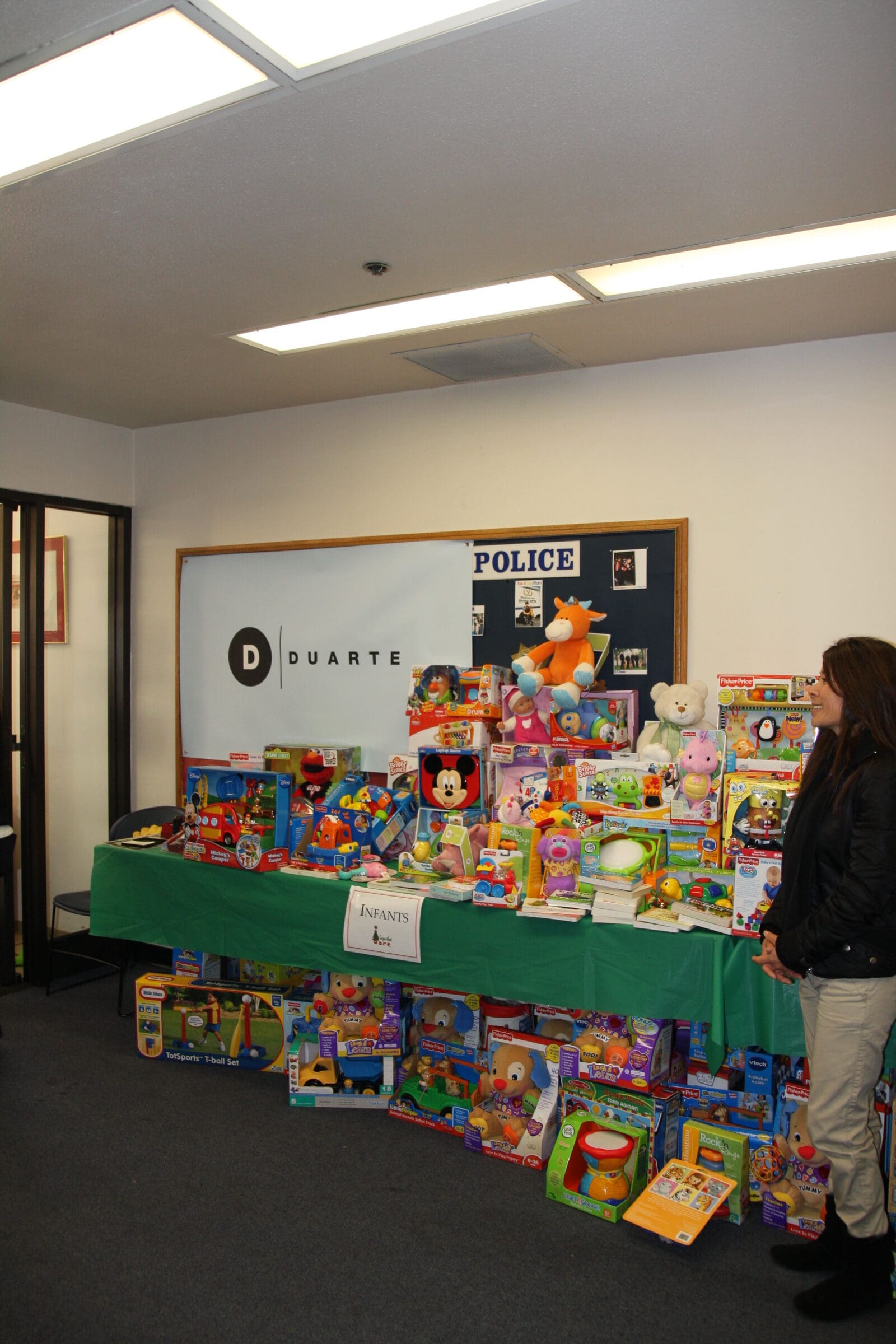 Duarte's table full of toy donations for the Cops That Care program