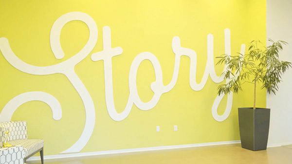 A yellow wall with the word "Story".